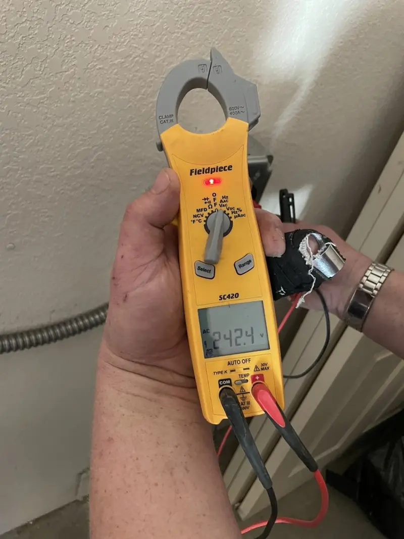 Voltage testing with clamp meter during Generator Installation in Montecito